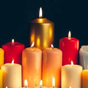 candles-burning-in-darkness-over-black-background-commemoration-concept.jpg